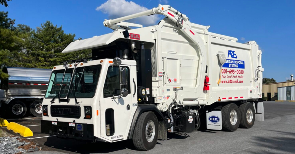 reliable trash company ADS Trash truck parked in parking lot